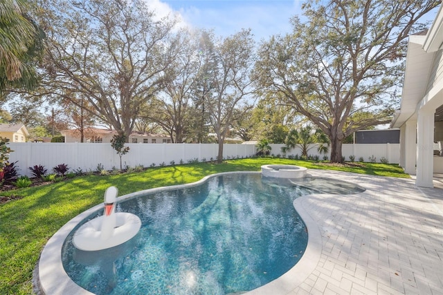 view of swimming pool with an in ground hot tub, a yard, and a patio area