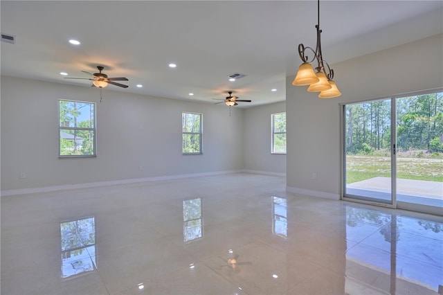 tiled empty room with plenty of natural light and ceiling fan