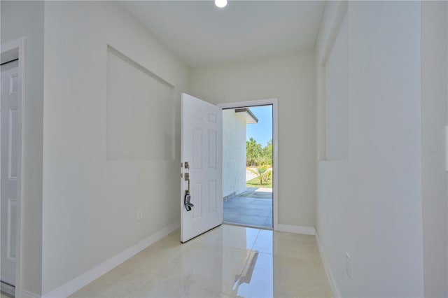 interior space featuring light tile floors