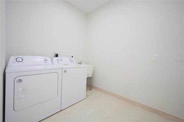 clothes washing area featuring hookup for an electric dryer and independent washer and dryer