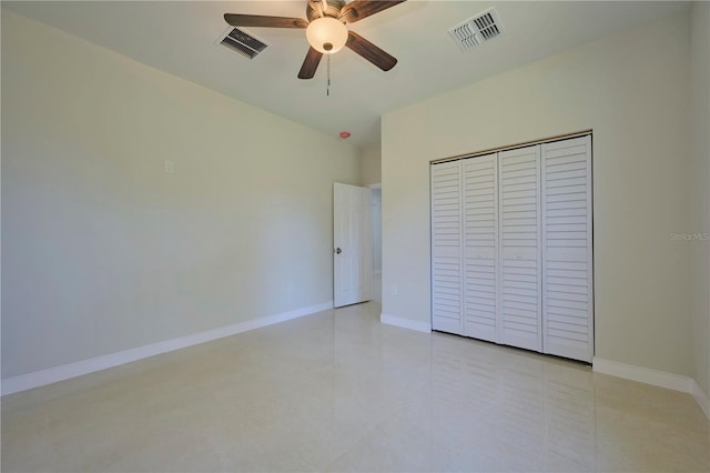 unfurnished bedroom featuring a closet, ceiling fan, and light tile flooring