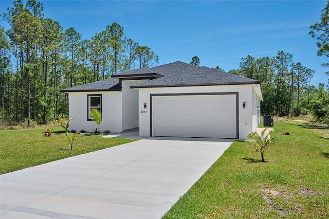 view of front facade with a garage and a front yard