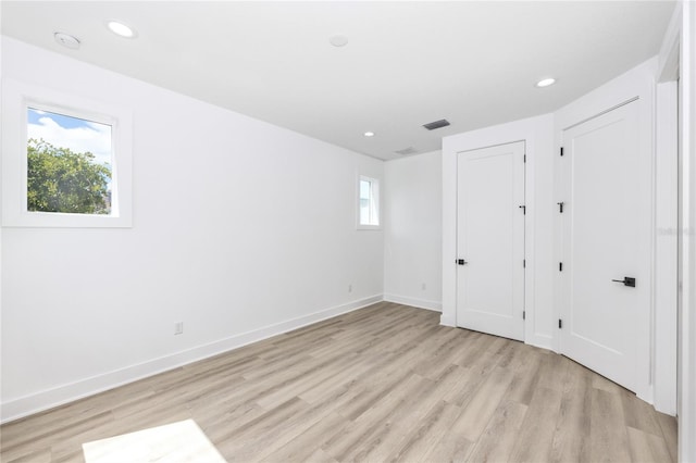 unfurnished bedroom with light hardwood / wood-style floors