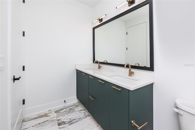 1308 E Columbus Dr Unit 2, Tampa, FL 33605 - bathroom featuring marble look tile flooring, double vanity, toilet, and baseboards