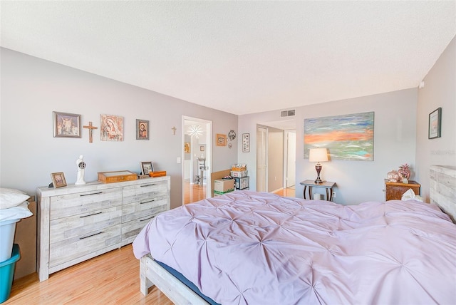 bedroom with light hardwood / wood-style flooring