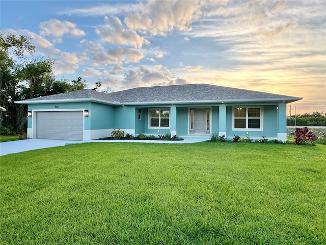 ranch-style home with a lawn and a garage