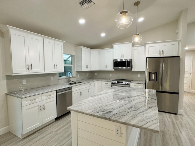 kitchen featuring sink, stainless steel appliances, and white cabinetry