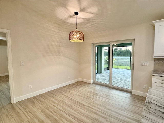 empty room with light wood-type flooring