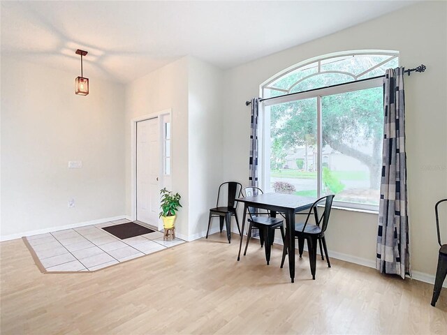 dining room featuring a wealth of natural light and light tile flooring