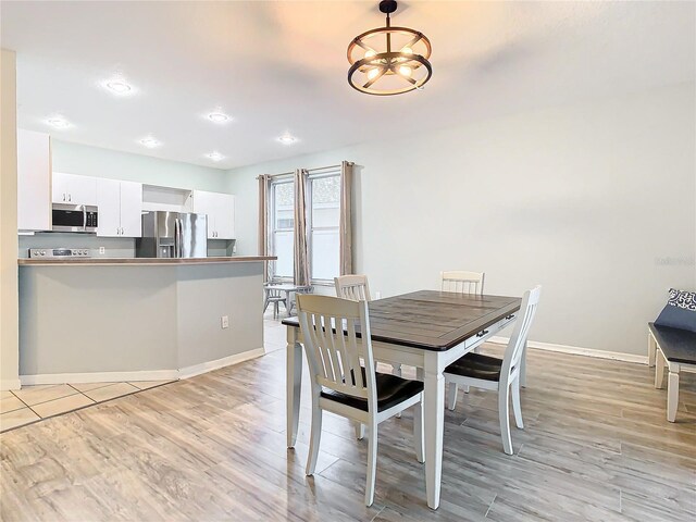 unfurnished dining area with light hardwood / wood-style flooring