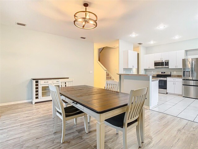 dining area with light tile floors