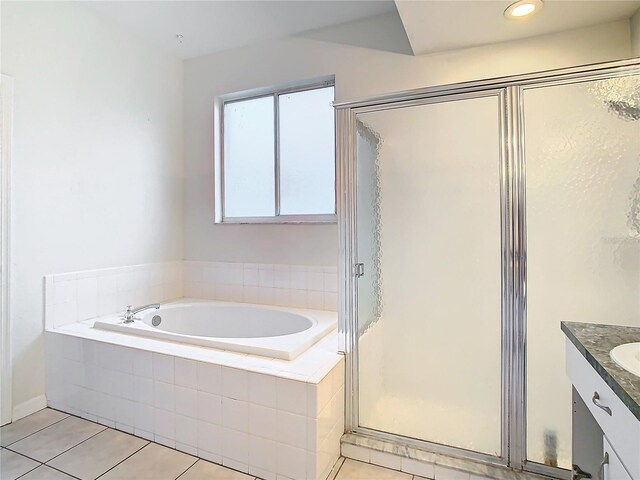 bathroom with separate shower and tub, tile flooring, and vanity