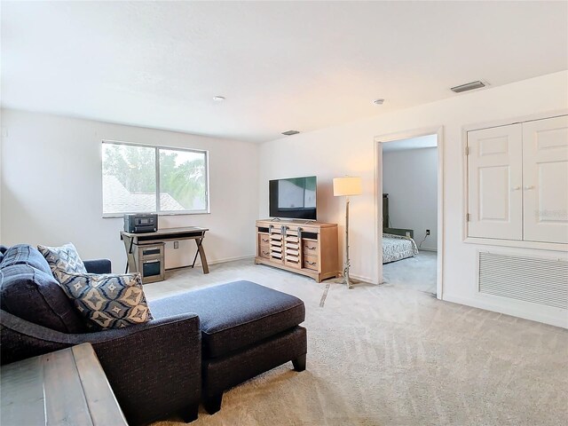 living room featuring light colored carpet