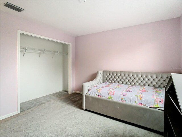 carpeted bedroom with a closet