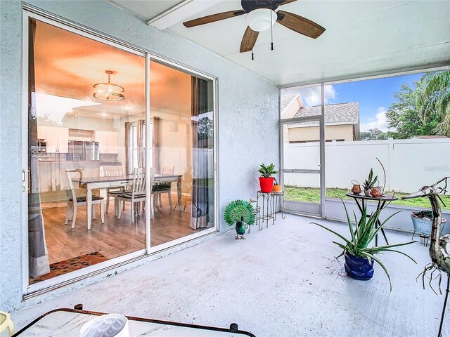 sunroom / solarium with ceiling fan