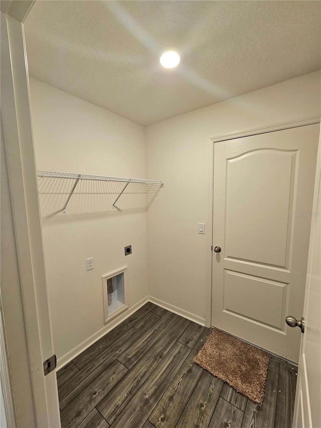 laundry area featuring dark hardwood / wood-style floors and electric dryer hookup