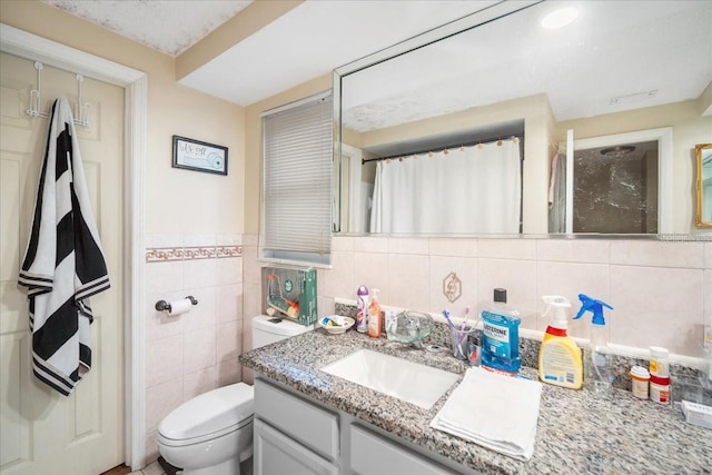 bathroom featuring tile walls, backsplash, vanity, and toilet