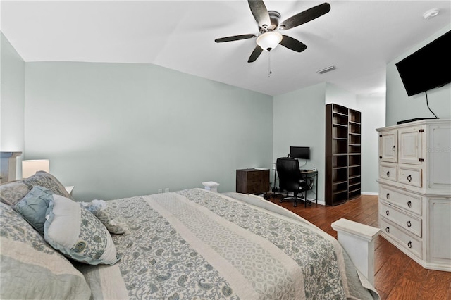 bedroom featuring ceiling fan, dark hardwood / wood-style floors, and lofted ceiling