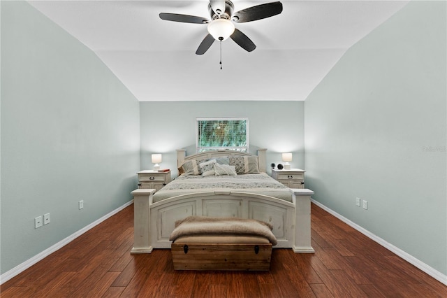 bedroom featuring dark hardwood / wood-style flooring, ceiling fan, and vaulted ceiling