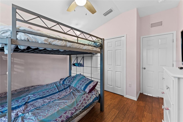 bedroom with ceiling fan, dark hardwood / wood-style flooring, and vaulted ceiling