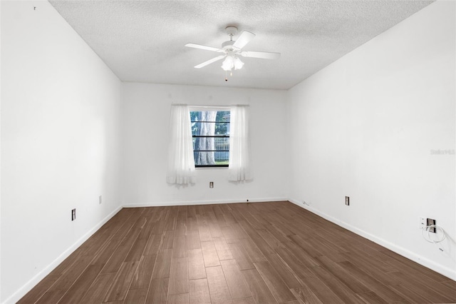 unfurnished room featuring dark hardwood / wood-style floors, ceiling fan, and a textured ceiling