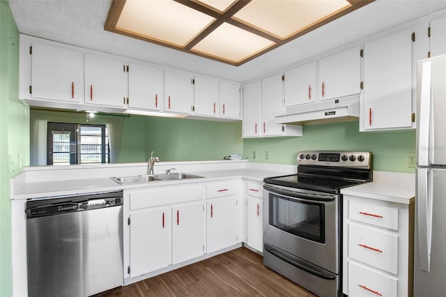 kitchen with stainless steel appliances, white cabinetry, and sink