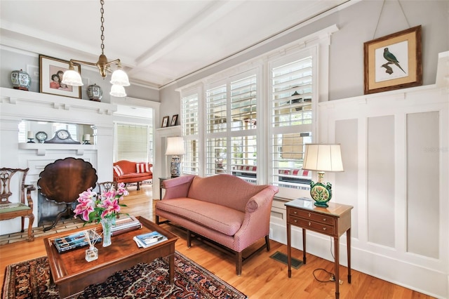 living room with coffered ceiling, wood-type flooring, and beamed ceiling