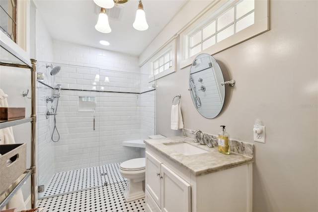 bathroom with vanity, toilet, and walk in shower