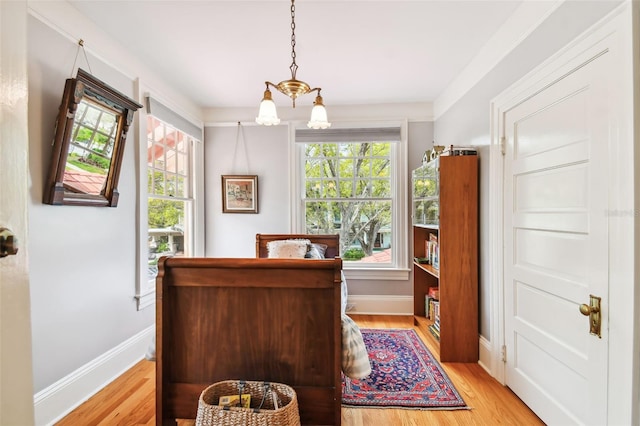 home office with a healthy amount of sunlight and light hardwood / wood-style floors