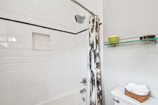 bathroom with shower / bathtub combination with curtain and toilet