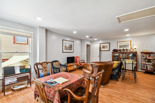 dining space with light hardwood / wood-style flooring