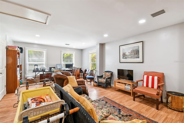 living room with light hardwood / wood-style floors