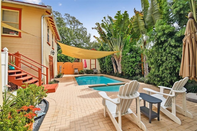 view of swimming pool with a patio