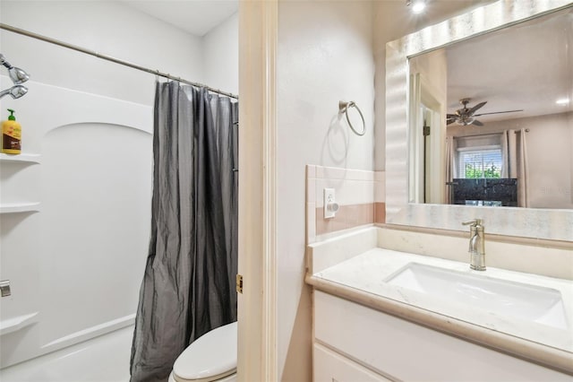 bathroom featuring ceiling fan, vanity, and toilet