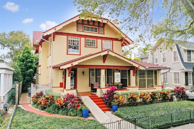 view of front of house with a porch and a front lawn