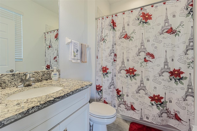 full bathroom featuring tile patterned floors, vanity, toilet, and shower / bath combo