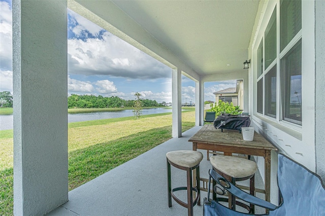 view of patio / terrace featuring a water view