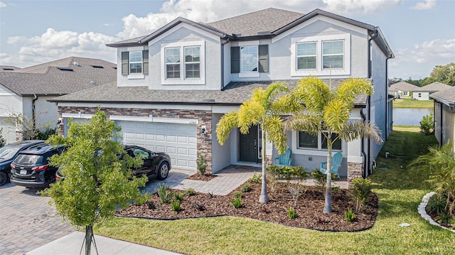 view of front of home with a garage and a front lawn