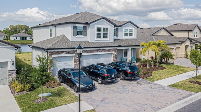 view of front facade with a garage and a front lawn