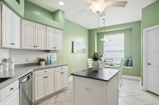 kitchen featuring tasteful backsplash, ceiling fan, stainless steel dishwasher, and white cabinetry