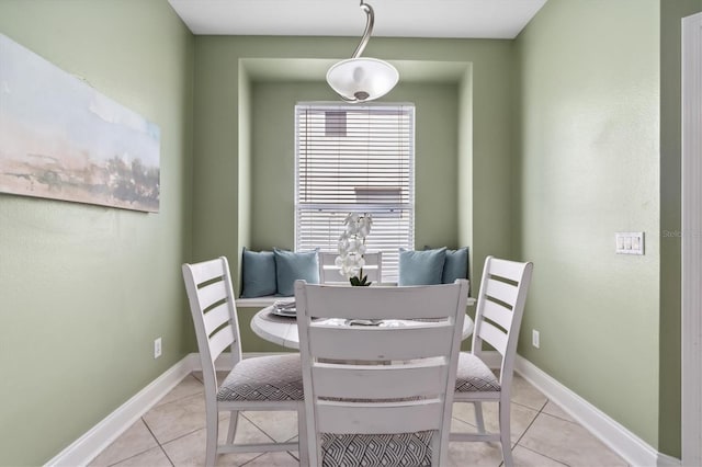 dining room with light tile floors