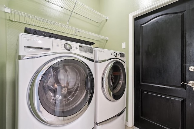 laundry area with independent washer and dryer