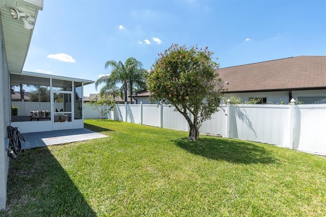 view of yard featuring a sunroom