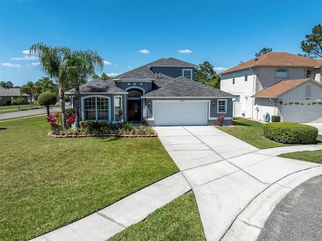 view of front of home featuring a garage and a front lawn