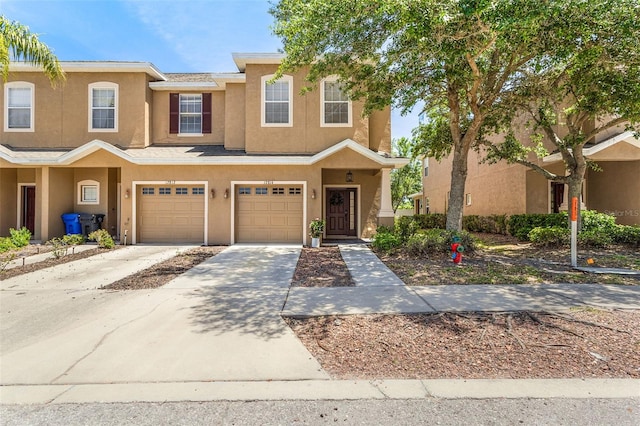 townhome / multi-family property featuring a garage