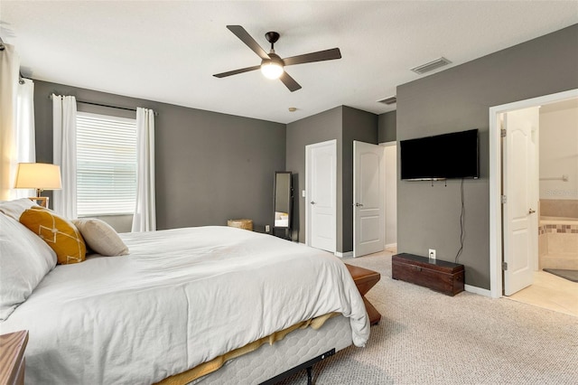 carpeted bedroom featuring ceiling fan and connected bathroom