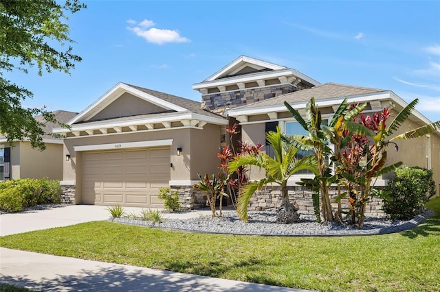 view of front of property featuring a garage and a front lawn