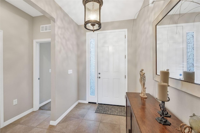 entrance foyer featuring light tile floors