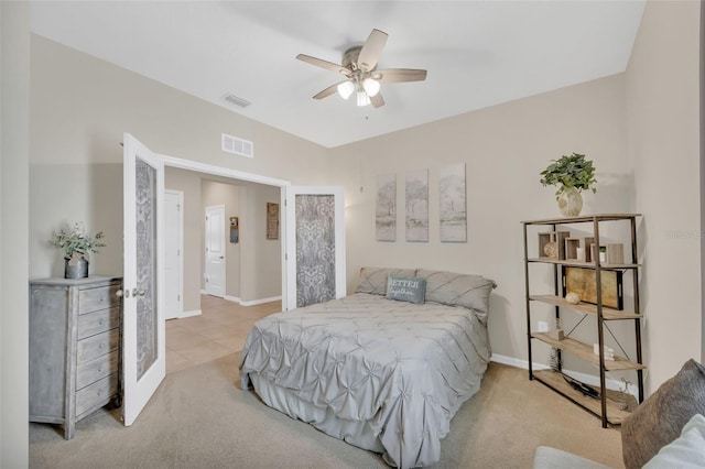 bedroom featuring light colored carpet and ceiling fan