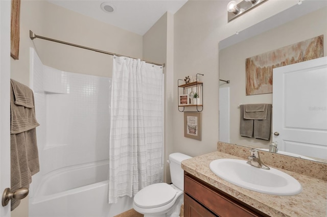 full bathroom featuring vanity, shower / bath combination with curtain, and toilet